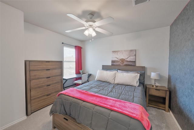 bedroom with light carpet, baseboards, visible vents, and a ceiling fan