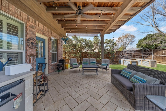 view of patio featuring a fenced backyard and an outdoor hangout area