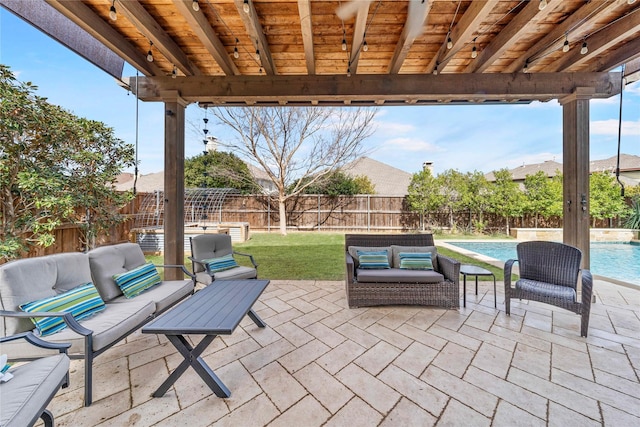 view of patio / terrace with an outdoor hangout area, a fenced backyard, and a fenced in pool