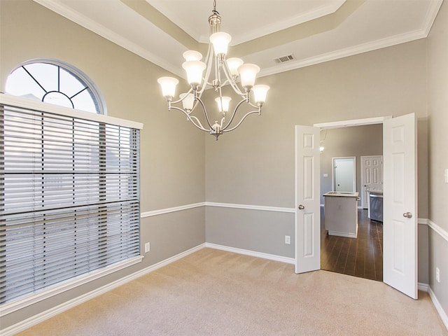 unfurnished room with a chandelier, visible vents, baseboards, carpet, and a raised ceiling