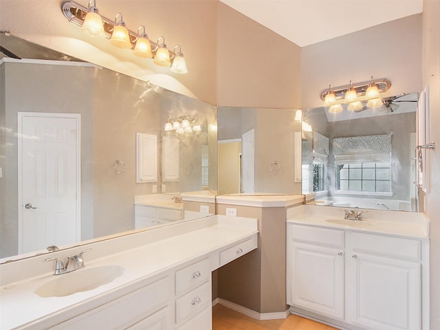 full bathroom with tile patterned flooring, two vanities, and a sink