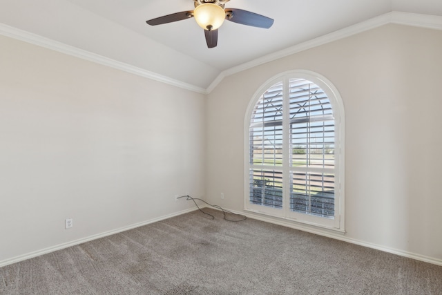 carpeted spare room featuring ceiling fan, lofted ceiling, and ornamental molding