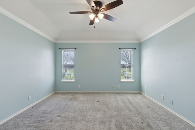 unfurnished room with lofted ceiling, crown molding, baseboards, and carpet floors