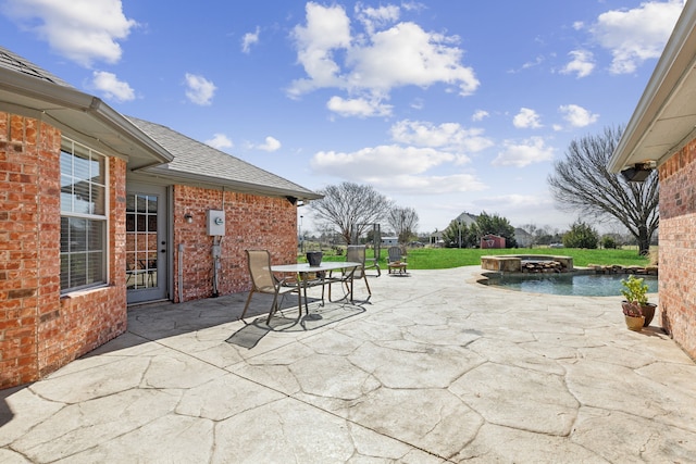 view of patio featuring outdoor dining area