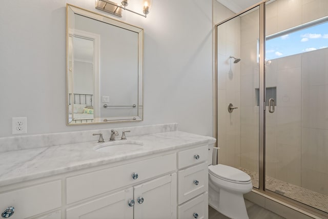 full bath with toilet, a stall shower, and vanity