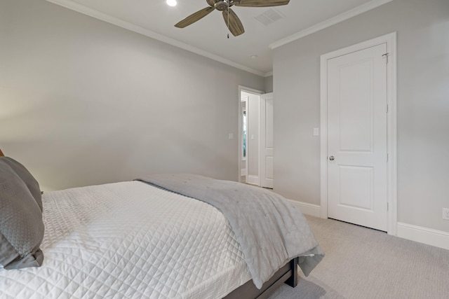 bedroom featuring ornamental molding, light colored carpet, visible vents, and baseboards