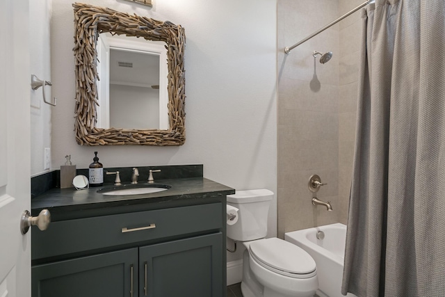 bathroom featuring toilet, visible vents, shower / bath combo with shower curtain, and vanity