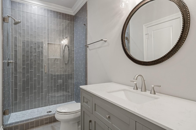 full bath featuring ornamental molding, a stall shower, vanity, and toilet