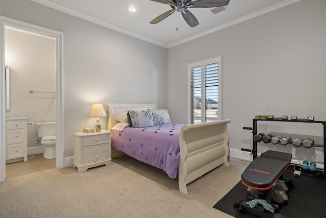 bedroom with connected bathroom, light colored carpet, visible vents, baseboards, and ornamental molding