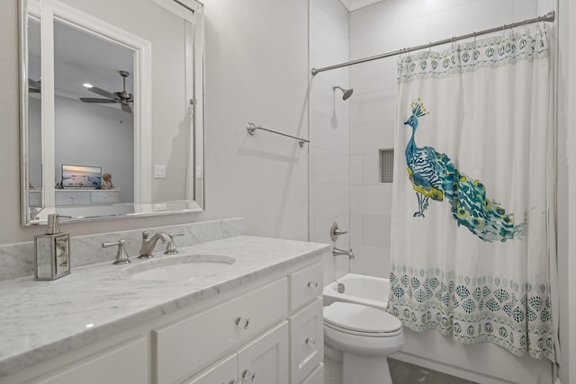 bathroom featuring toilet, ceiling fan, shower / bath combo, and vanity