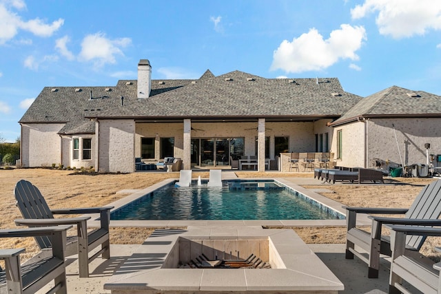 outdoor pool featuring a ceiling fan and a patio