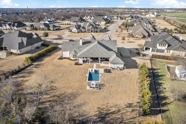 birds eye view of property with a residential view