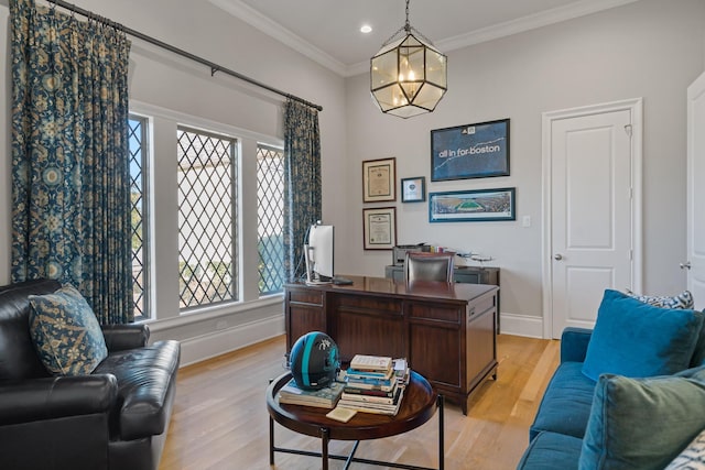 office area with ornamental molding, baseboards, and light wood finished floors