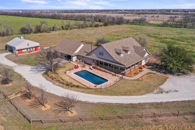 birds eye view of property with a rural view