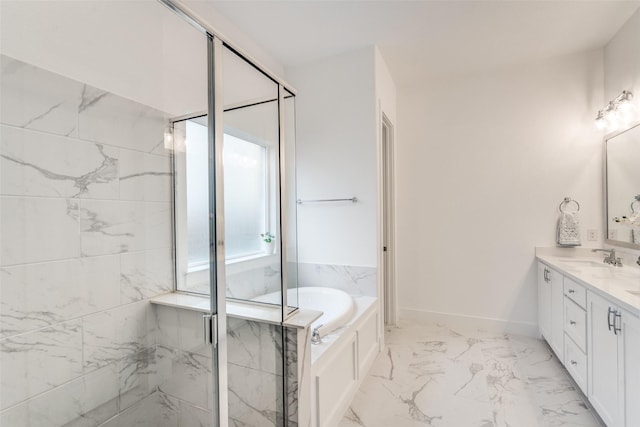 bathroom with marble finish floor, a stall shower, vanity, baseboards, and a bath