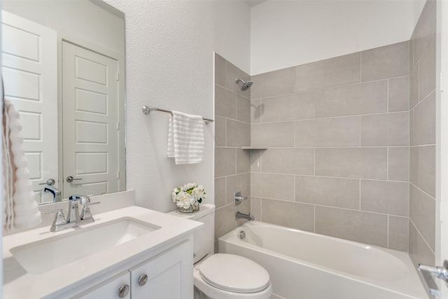 full bathroom featuring toilet, tub / shower combination, and vanity