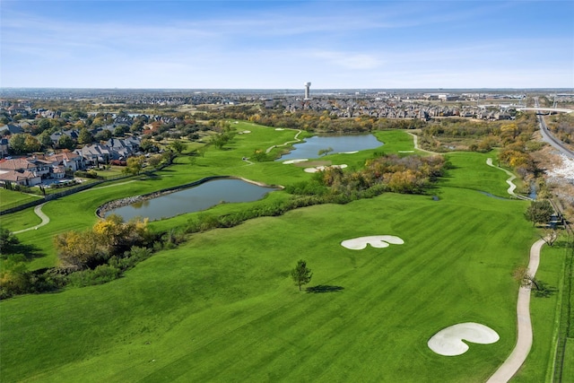 bird's eye view with a water view and view of golf course