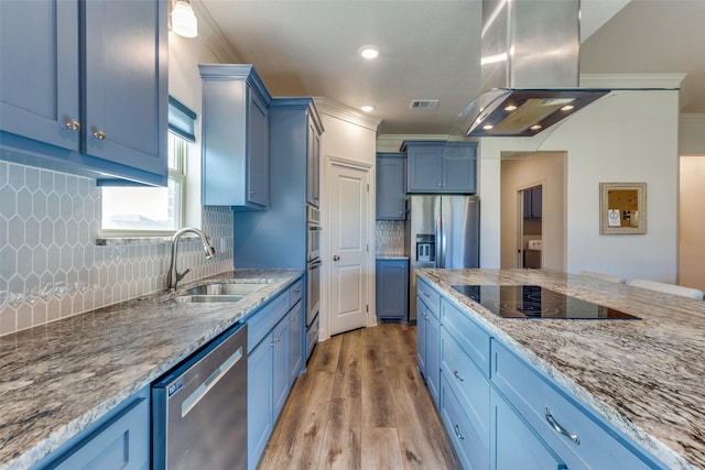 648 Half Moon Way, Runaway Bay, TX 76426 - kitchen with stainless steel appliances, blue cabinets, a sink, recessed lighting, and ornamental molding