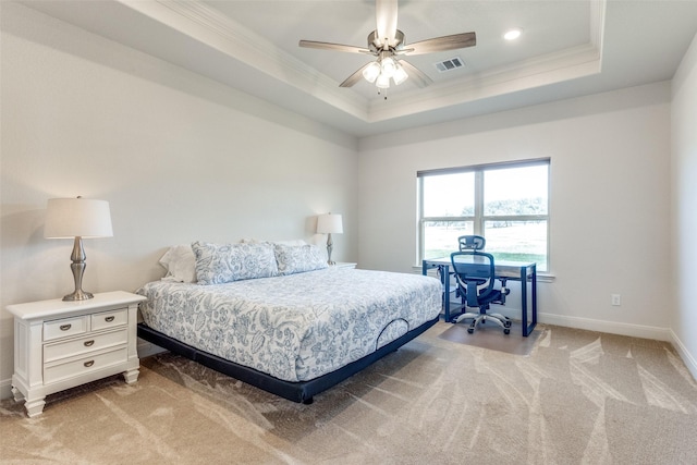 bedroom featuring ornamental molding, a raised ceiling, visible vents, and light carpet