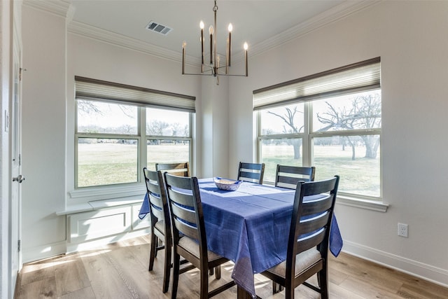 648 Half Moon Way, Runaway Bay, TX 76426 - dining space with a chandelier, light wood-style floors, ornamental molding, and baseboards