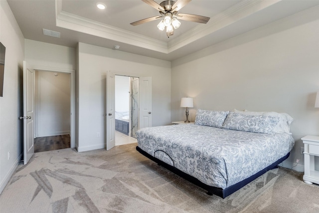 648 Half Moon Way, Runaway Bay, TX 76426 - bedroom with ornamental molding, a tray ceiling, light colored carpet, baseboards, and connected bathroom