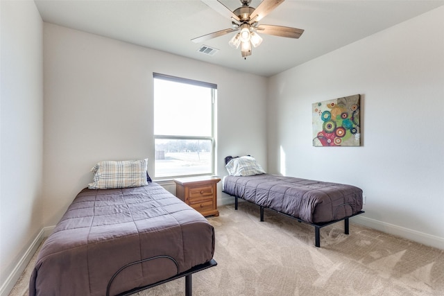 bedroom with visible vents, ceiling fan, light carpet, and baseboards