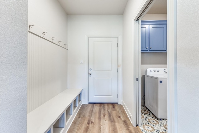 mudroom with light wood finished floors and washer / clothes dryer