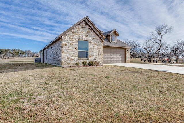 view of front of property with driveway, stone siding, and a front lawn