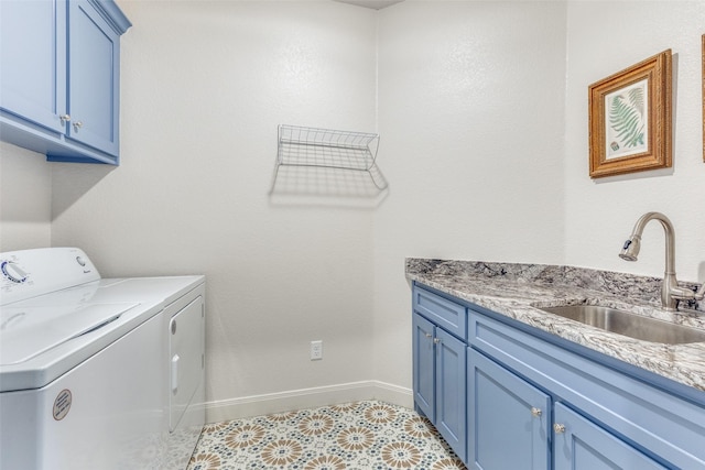 laundry room featuring independent washer and dryer, cabinet space, a sink, and baseboards