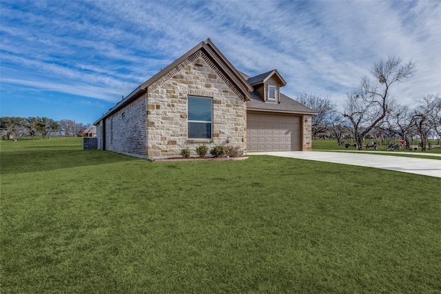 648 Half Moon Way, Runaway Bay, TX 76426 - view of front of home featuring concrete driveway, stone siding, a front lawn, and a garage