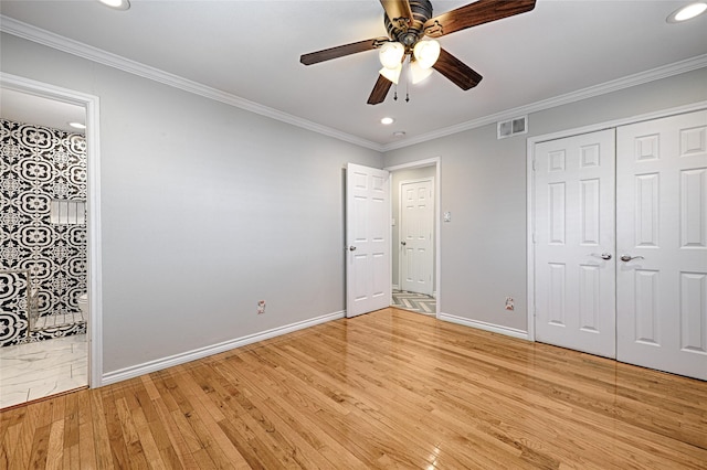 unfurnished bedroom with crown molding, light wood finished floors, recessed lighting, visible vents, and baseboards