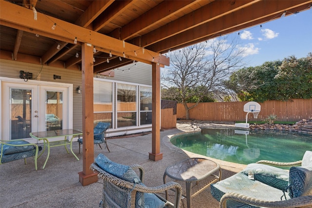 view of patio featuring a fenced backyard and french doors