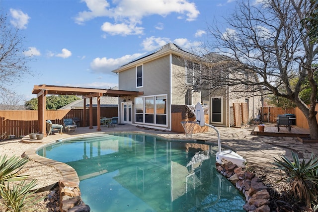 view of swimming pool featuring a patio area, a fenced backyard, and a fenced in pool