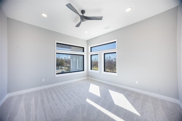 carpeted empty room featuring recessed lighting, visible vents, ceiling fan, and baseboards