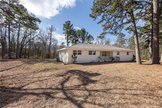 rear view of property with cooling unit