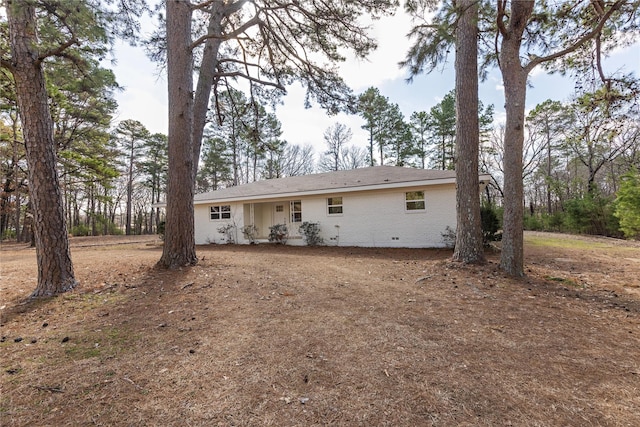 rear view of property featuring brick siding