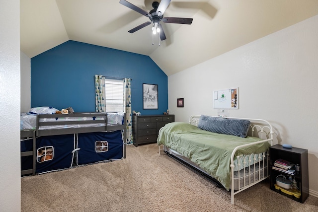 carpeted bedroom featuring lofted ceiling and ceiling fan