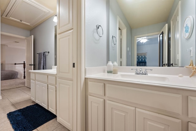 ensuite bathroom featuring ensuite bathroom, ceiling fan, tile patterned flooring, and vanity