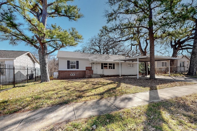 ranch-style house featuring brick siding, a front yard, crawl space, fence, and an attached carport