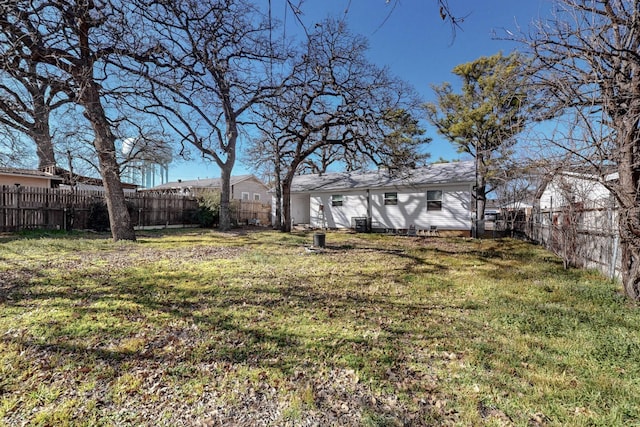 view of yard with a fenced backyard and cooling unit