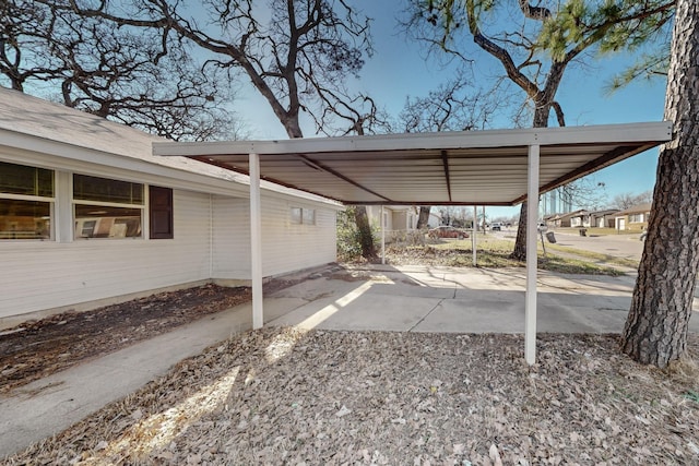 view of vehicle parking featuring a carport and driveway