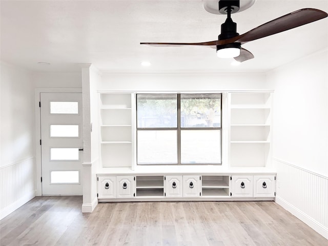 mudroom featuring wainscoting, plenty of natural light, and light wood-style floors