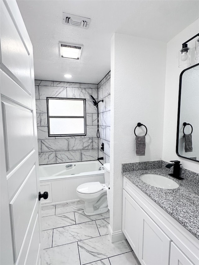 bathroom featuring marble finish floor, shower / bath combination, visible vents, toilet, and a textured ceiling