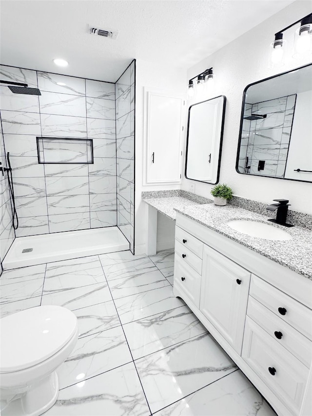 full bath with visible vents, marble finish floor, a marble finish shower, and vanity