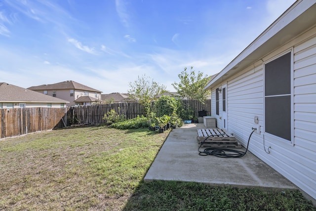 view of yard featuring a patio area and a fenced backyard