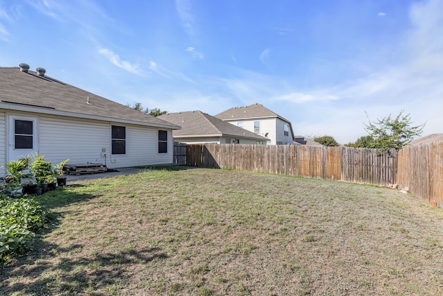 view of yard with a fenced backyard