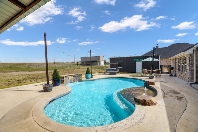 view of pool featuring a fenced in pool, fence, and a patio area