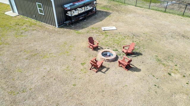 details featuring fence and an outdoor fire pit