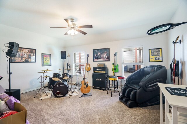 rec room featuring baseboards, carpet, and a ceiling fan