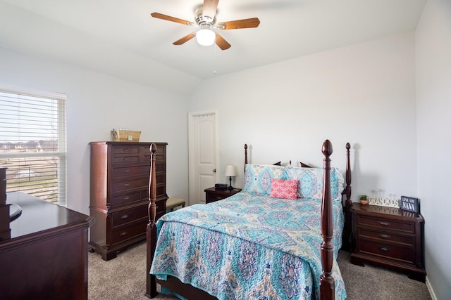 carpeted bedroom with lofted ceiling and a ceiling fan